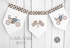 three small pennants with motorcycles on them