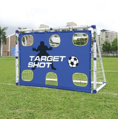 a soccer goal set up in the middle of a field with a sign that says target shot