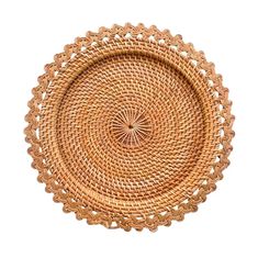 a round woven tray with an intricate design on the bottom and sides, made out of wicker