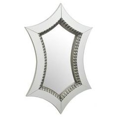 a white mirror with an intricate design on the front and back side, against a white background