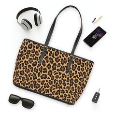 This stylish PU Leather Shoulder Bag featuring a leopard design is perfect for a weekend getaway or everyday use. It makes a great birthday or holiday gift for a fashionable Mom or daughter. The vibrant colors and custom design add a touch of personality to any outfit. Product features - 100% PU leather construction - Adjustable handles for convenience - Multiple pockets for organization - Double-sided print for added style - Available in two sizes Care instructions - Do not dryclean - Do not ex Trendy Leopard Print Travel Bag, Casual Leopard Print Shoulder Bag For Travel, Casual Leopard Print Travel Bag, Leopard Print Bag With Animal Design For Everyday, Travel Leopard Print Shoulder Bag, Leopard Print Travel Bag With Animal Design, Leopard Print Everyday Use Bag With Animal Design, Everyday Leopard Print Shoulder Bag With Animal Design, Large Capacity Leopard Print Shoulder Bag For Travel