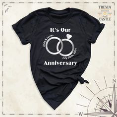 "Its Our Anniversary Shirt, Custom Wife Husband Honeymoon Gift Tshirt, Wedding Anniversary Matching Couple Tees, Gift for Wifey Hubby Shirts Celebrate your love story with our \"Its Our Anniversary Shirt\" designed to commemorate the beautiful journey you've shared together. Whether you're marking one year or twenty, our custom tee is the perfect way to honor your special day. Made for couples who believe in celebrating love in style, our shirt is a thoughtful choice for a wife, husband, or part Anniversary Crew Neck Top With Graphic Print, Anniversary Crew Neck Shirt With Graphic Print, Anniversary Graphic Print Crew Neck Shirt, Black Short Sleeve Top For Anniversary, Crew Neck Cotton Top For Anniversary, Cotton Crew Neck Top For Anniversary, Its Our Anniversary, Hubby Wifey Shirts, Family Love Quotes