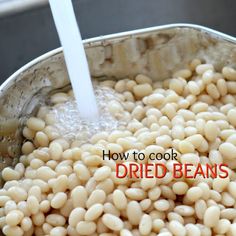 white beans being cooked in a pot with the words, how to cook dried beans