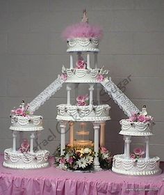 a wedding cake is displayed on a table