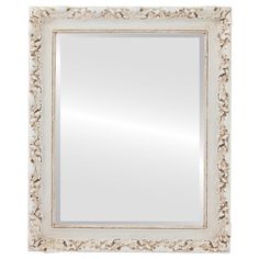 a white framed mirror with an ornate design on the front and bottom edge, against a white background