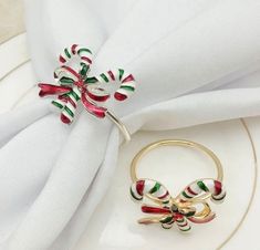 a napkin with an ornament on it next to a ring