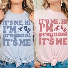 two women wearing matching tshirts that say it's me, i'm pregnant and its me