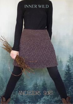 a woman in a black shirt and brown skirt is holding a plant with the words inner wild on it