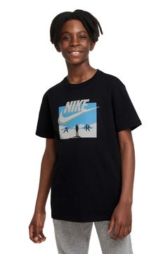 A roomy fit furthers the relaxed style of a cotton crewneck T-shirt that'll bring a sporty vibe to your kiddo's school-day looks. 100% cotton Machine wash, dry flat Imported Nike Sports T-shirt With Logo, Sporty Relaxed Fit T-shirt With Logo, Athleisure Sports T-shirt With Logo, Sports Logo T-shirt In Athleisure Style, Athleisure T-shirt With Sports Logo, Sporty School T-shirt With Graphic Print, Sporty Graphic Print T-shirt For School, School Crew Neck T-shirt With Logo Print, Nike Sporty Top With Logo