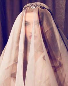 a woman with a veil on her head