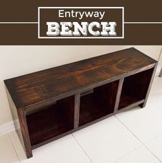 the entryway bench is made from wood and has three cubbys on each side