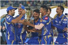 the mumbai indians celebrate with the ipl trophy after winning the match against delhi knight riders