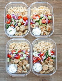 four meal prep containers filled with chicken, rice and veggies on a wooden table