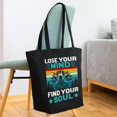 a black tote bag that says lose your mind find your soul