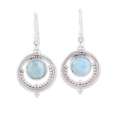 Within a ring of silver a shimmering cabochon of larimar conjures images of an ethereal full moon in this pair of dangle earrings from India. Neeru Goel expresses her childhood passion for jewelry and gemstones giving these earrings a handcrafted design from sterling silver with petite dot motifs accentuating the elegant modern appeal. Elegant Larimar Dangle Earrings, Elegant Larimar Cabochon Jewelry, Elegant Round Larimar Jewelry, Silver Larimar Dangle Earrings, Silver Larimar Dangle Jewelry, Pink Opal Ring, Larimar Earrings, Silver Jewelry Accessories, Boho Earring