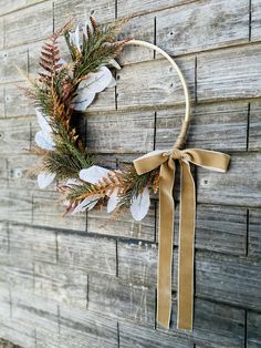 a wreath hanging on the side of a wooden wall