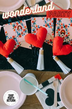 there is a table set up with paper plates and napkins for valentine's day