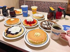 a table topped with pancakes and other breakfast foods