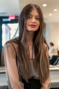 Woman with ultra-long straight hair styled with sharp, razor-cut ends Modern Hairstyles, Clean Lines, Straight Hairstyles, Long Hair, Tap