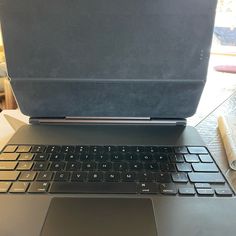 an open laptop computer sitting on top of a table