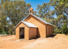 an old brick church with a bell tower