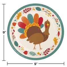 a turkey plate with leaves and acorns painted on the side, along with measurements