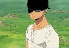 an anime character with black hair wearing a white shirt and green grass in the background