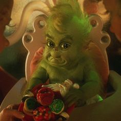 an image of a baby yoda sitting in a chair