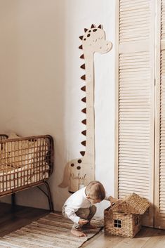 a little boy that is kneeling down on the floor