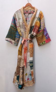 Beautiful Indian Silk kimono Vintage Recycled Silk Sari Kimono, Boho Silk Kimono Robe, Bikini Cover up Bathrobe, Beach Cover Up This gown is luxury Indian Silk, a beautiful soft, elegant and sensual fabric, which drapes beautifully over the body. These robes are the perfect present for a loved one or for yourself. The fabric is so luxurious and beautiful. Great to wear around the house or to dress up with jewellery or with some jeans & a t-shirt to go out. NOTE : This is vintage patchwork item. Traditional Patchwork Kimono For The Beach, Traditional Patchwork Beach Kimono, Beach Festival Kimono With Kimono Sleeves, Vintage Multicolor Kimono For The Beach, Vintage Multicolor Kimono For Beach, Multicolor Patchwork Kimono For The Beach, Multicolor Patchwork Kimono For Beach, Multicolor Patchwork Beach Kimono, Beach Patchwork Multicolor Kimono