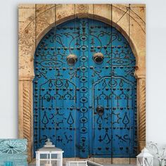 a blue door with ornate designs on it