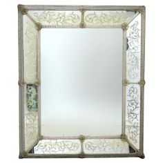 an ornate mirror is shown against a white background