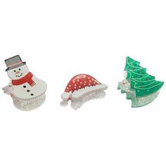 three small plastic christmas decorations on a white background