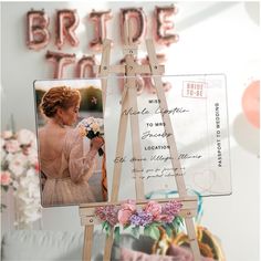 a wooden easel holding a photo of a bride