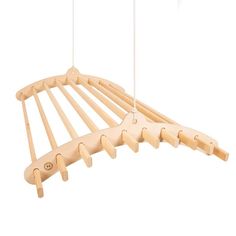 a wooden rack with clothes hanging from it's sides and two strings attached to the top