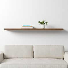 Minimalist + function-forward, this floating shelf displays decor, brings interest to a blank wall, or clears the clutter off your counters. It’s available in a range of neutral finishes – so it’s easy to find one that suits your space – and it arrives with hanging hardware. AllModern Size: 1.97" H x 74.81" W x 10.24" D, Finish: Walnut AllModern Sherice Floating Shelf in Walnut | Size 1.97" H x 74.81" W x 10.24" D Walnut Wood Wall, Wood Wall Shelf, Wood Floating Shelves, Shelf Styling, Floating Shelf, Wall Mounted Shelves, Wall Organization, Decor Display, Blank Walls