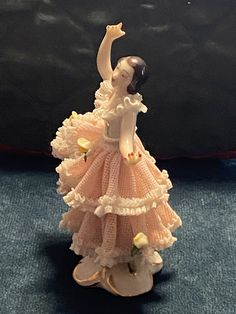 there is a figurine that looks like a woman in a dress