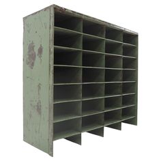 an old metal shelf with many compartments