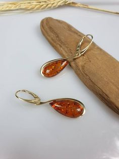 Amber earrings. Cognac - brown Amber. Gold plated Sterling silver 925 with hallmarks. Genuine Amber. Suitable pendant is also available please contact me for more details. Lever back lock. About 4.5 cm length. https://www.etsy.com/shop/AmberLithuania?ref=simple-shop-header-name&listing_id=780205095&section_id=27948198 Classic Gold Jewelry With Baltic Amber, Formal Baltic Amber Earrings, Classic Baltic Amber Gold Jewelry, Multicolor Earrings, Amber Earrings, Natural Amber, Amber Necklace, Amber Beads, Amber Jewelry