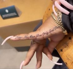 a woman's hand with an inscription on it that says, i am not man but only god