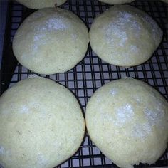 six round doughnuts cooling on a wire rack