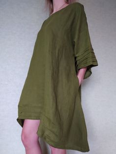 "Loose linen tunic with pockets. Great choice when you need comfortable and stylish outfit combination. You can wear it with trousers, leggings, shorts, skirts. The good thing about tunics is that you can wear them also by themselves with nothing or for example as beach cover ups. Linen tunic dress is perfect for warm days and vacation. As linen regulates body temperature, is lightweight and really absorbent, which makes it the perfect fabric for summer. ABOUT Length of this linen tunic on back Khaki Beach Dresses With Pockets, Beach Dresses With Pockets In Khaki, Green Relaxed Fit Linen Beach Dress, Summer Cotton Tunic With Pockets, Spring Tunic With Pockets And Relaxed Fit, Spring Relaxed Fit Tunic With Pockets, Green Linen Dress With Pockets For Spring, Spring Green Linen Dress With Pockets, Green Relaxed Fit Linen Dress With Pockets