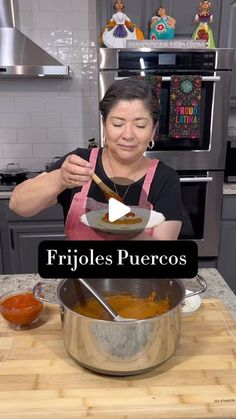 a woman is cooking in her kitchen with the words frigoles puercos