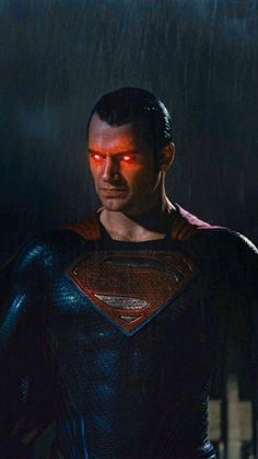 superman in the rain with red glowing eyes and his head turned to look like he is wearing