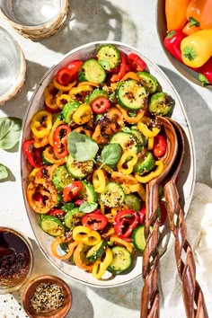 a bowl filled with sliced bell peppers and other vegetables