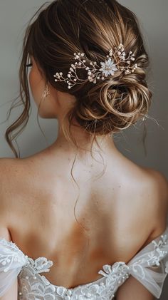 the back of a woman's head wearing a bridal hair comb