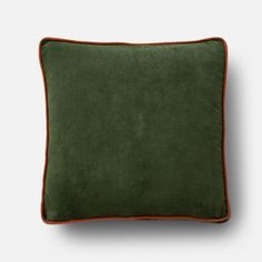 a green pillow with an orange piping on the front and back side, against a white background