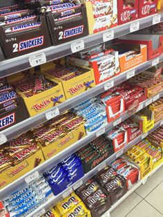 an assortment of snacks on display in a store