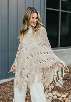 [Color: Mushroom]  An ultra bohemian crochet fringed tan poncho sweater. 70s Inspired Crochet, Crochet Poncho With Sleeves, Poncho With Sleeves, Knit Poncho, Crochet Poncho, Knitted Poncho, 70s Inspired, Cool Vintage, Open Knit