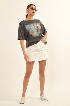 Distressed, mineral washed graphic t-shirt. Vintage-style KISS multicolor logo print. Torn and distressed detailing at neckline, cuffs, and hem. Round neckline. Short sleeves. Drop shoulder. Loose, oversized fit. 100% Cotton. Imported top designed and printed in Los Angeles, CA. Officially licensed KISS merchandise. Not eligible for discounts. Model wears size S. Casual Acid Wash T-shirt With Frayed Hem, Acid Wash Short Sleeve Tops With Frayed Hem, Acid Wash T-shirt With Frayed Hem And Relaxed Fit, Acid Wash Cotton T-shirt With Frayed Hem, Trendy Acid Wash Top With Frayed Hem, Trendy Stonewashed Cotton Tops, Grunge Crew Neck Top With Frayed Hem, Trendy Distressed Faded Tops, Trendy Faded Distressed Tops